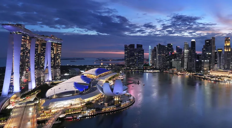 Marina Bay, illustrative photograph: Marina Bay at night, the Marina Bay Sands towers and ArtScience Museum beside the bay with the city lights behind