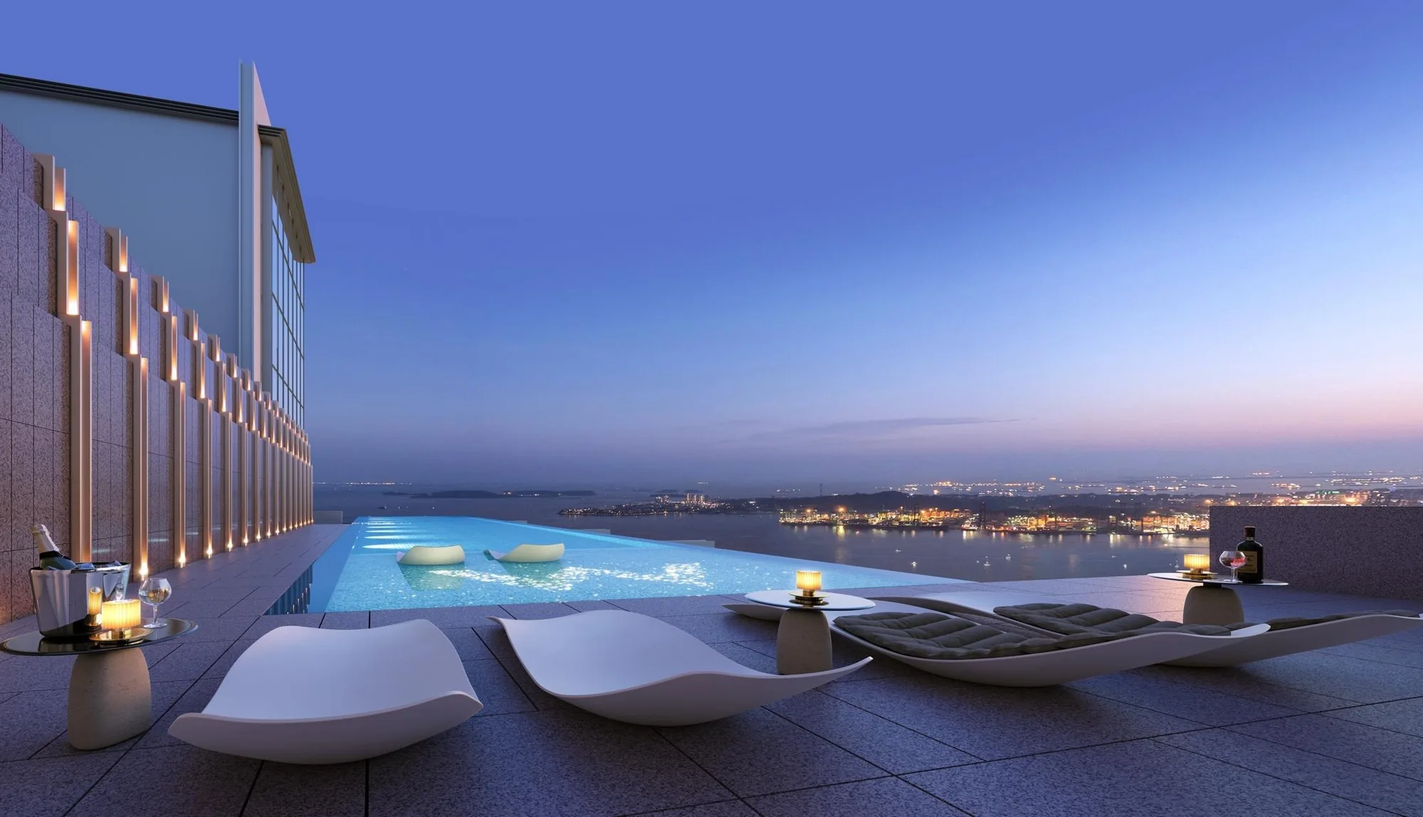 W Residences Marina View, artist&rsquo;s impression: the heated Sky Pool on Level 51 at dusk, white loungers beside an infinity edge that looks out over the sea and Sentosa