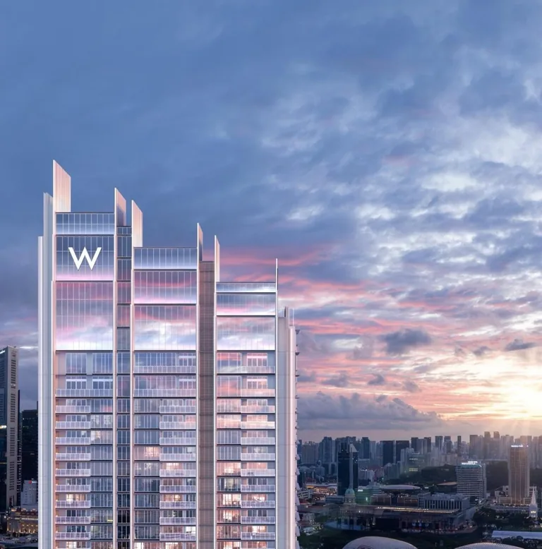 W Residences Marina View, artist’s impression: the crown of the tower, its vertical fins stepping up into slender points against a pink evening sky